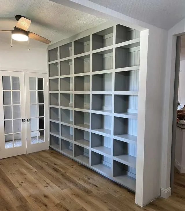 Floor-to-ceiling built-in shelving installed in a Flower Mound home