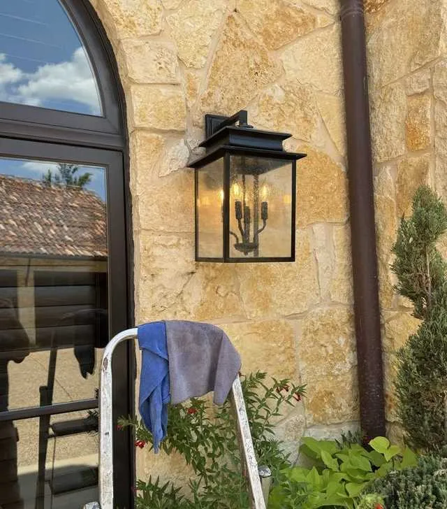 Exterior lantern mounted on stone, installed and wired