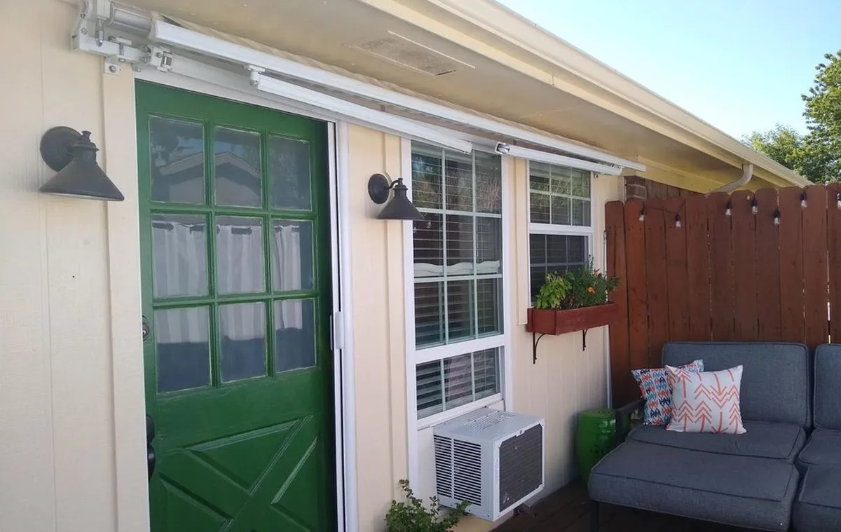 Painted exterior trim, door and window on a covered porch
